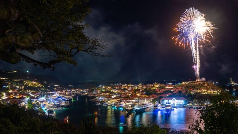 Superyachts anchored in Gustavia Harbour, St Barts, during New Year's Eve fireworks